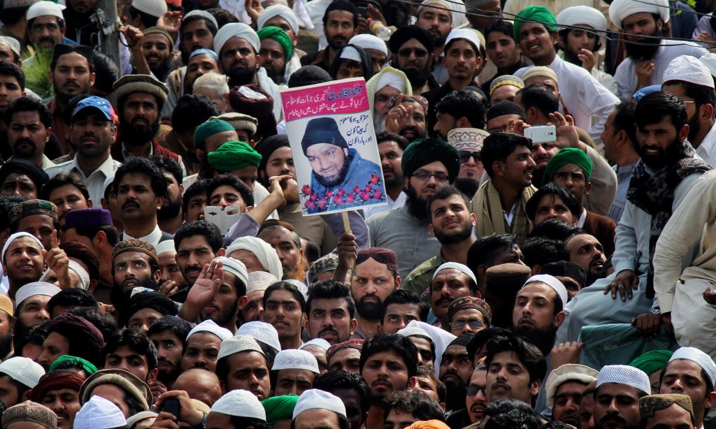 Supporters of Mumtaz Qadri during his funeral. Photograph: Anjum Naveed/AP